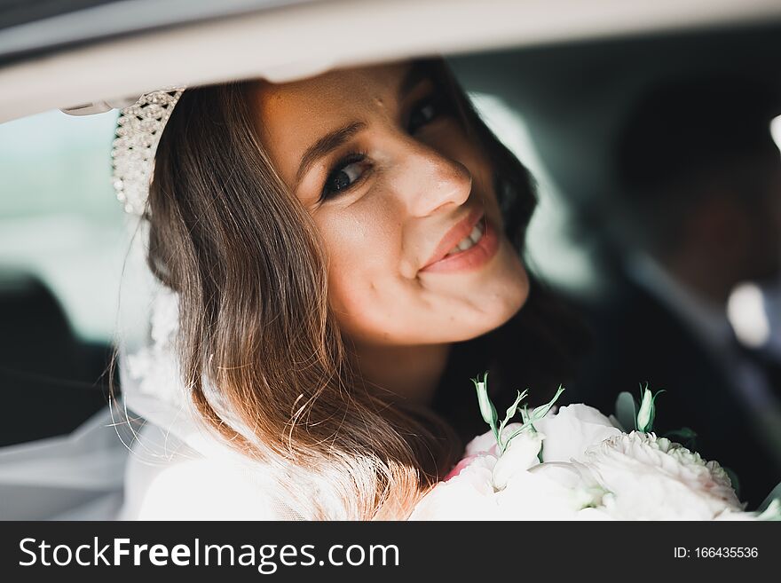 Beautiful Bride Sitting In The Luxury Retro Car On Wedding Day