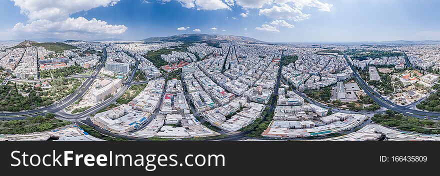 Aerial panoramic drone shot of west Athens with Lycabettus hill , Garden Byzantine , war musuem
