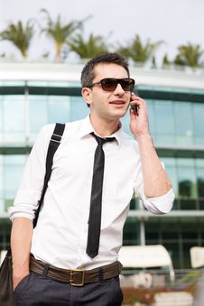 Manager Speak On Phone Across Office Stock Photo Manager Speak On Phone Across Office Stock Photo