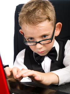 Kid In Glasses And Laptop Royalty Free Stock Images