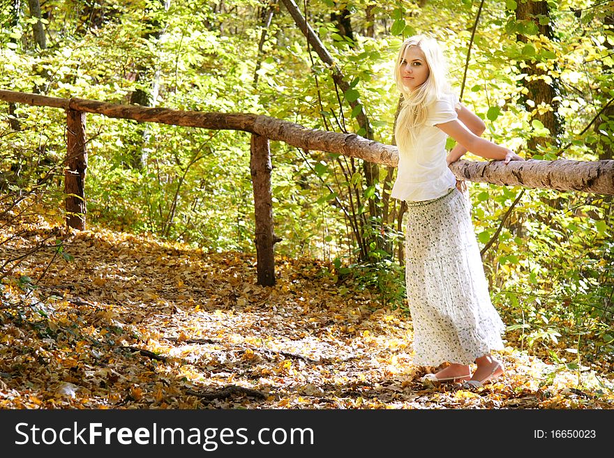 Young beautiful woman in forest