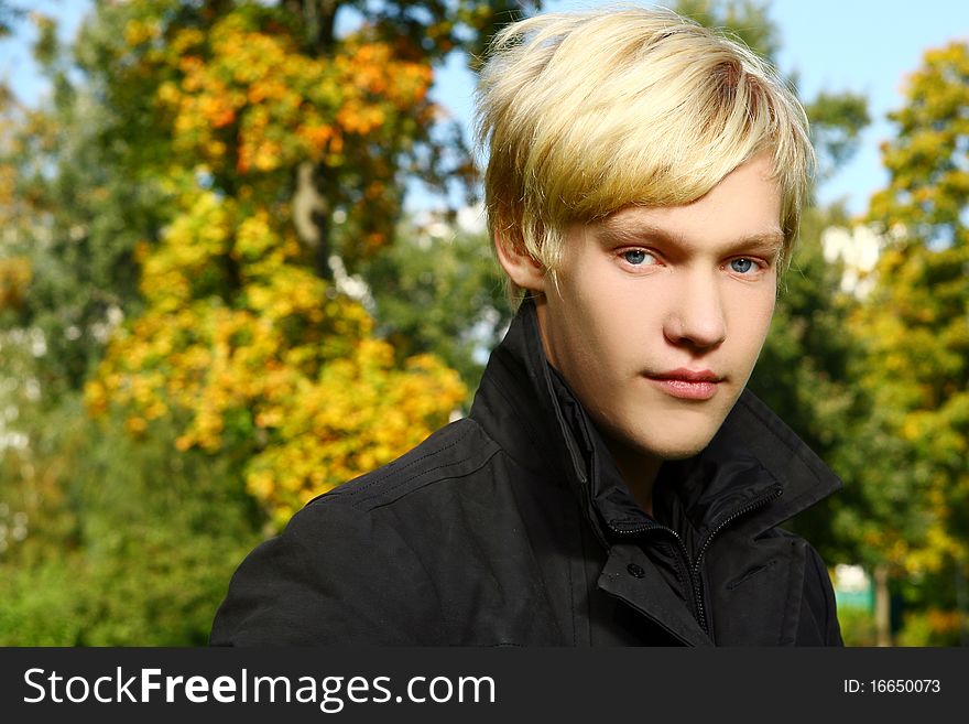 Attractive Blond Boy In Park