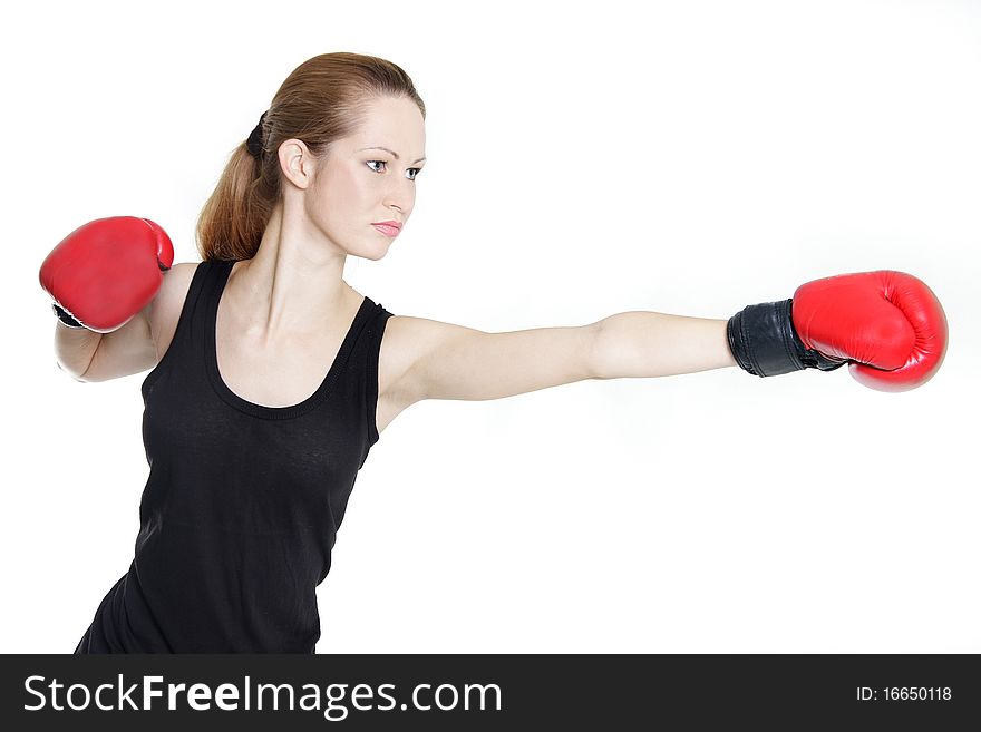 Young female boxer over white