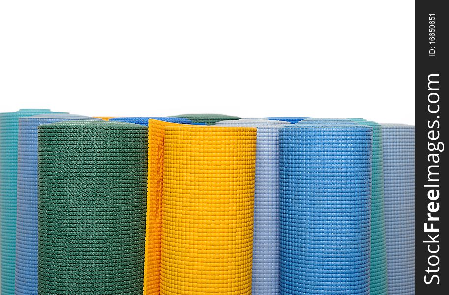 Many colorfull yoga mats as a background. isolated on white background