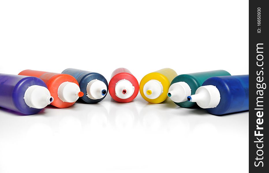 Various color tubes on white background