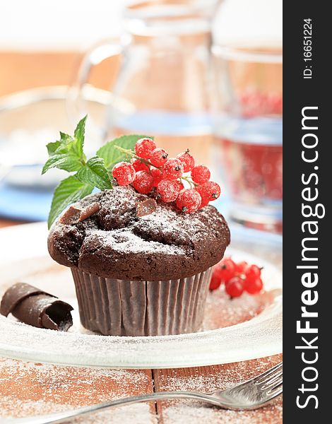 Chocolate muffin styled with red currant - detail