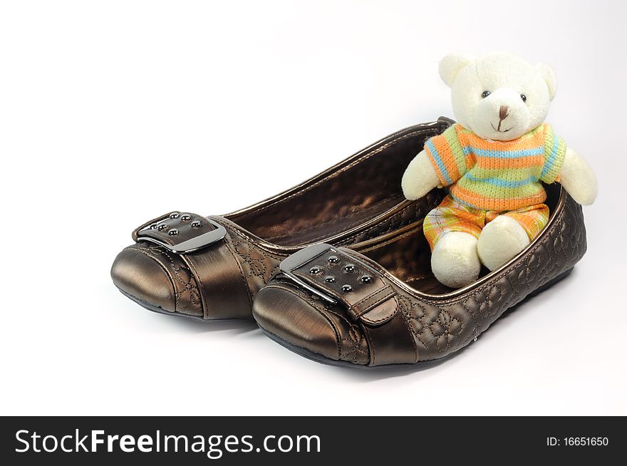 Brown casual shoes for woman and Teddy bear. Brown casual shoes for woman and Teddy bear.