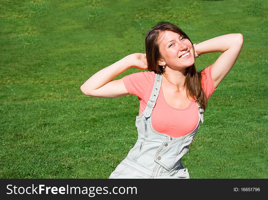 Beautiful Young Student On The  Green Lawn