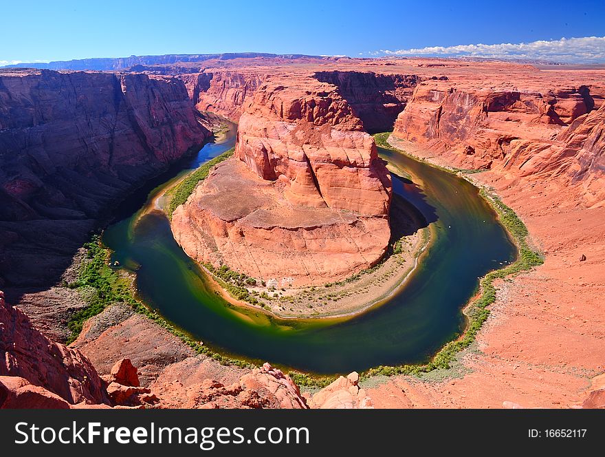 Horseshoe Bend is a dramatic and beautiful example of what happens when you combine water, sandstone and time. Currently, the Colorado River has cut through more than 1,000 feet of sandstone and still working!