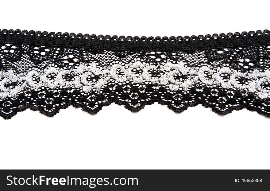 Black lace with pattern in the manner of white flower on white background