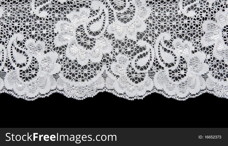 White lace with pattern in the manner of flower on black background