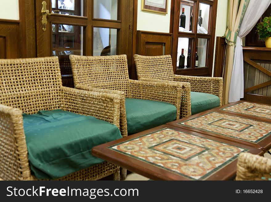 Interior of the restaurant with braided chair and tables