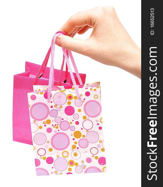 Paper bags in female hand isolated background