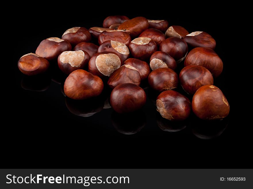 Several Chestnut on black background. Several Chestnut on black background