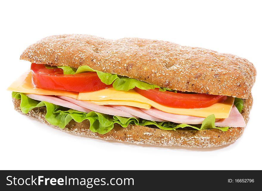 Sandwich with ham and vegetables on white background