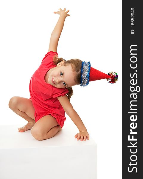 Little girl in Christmas hat.