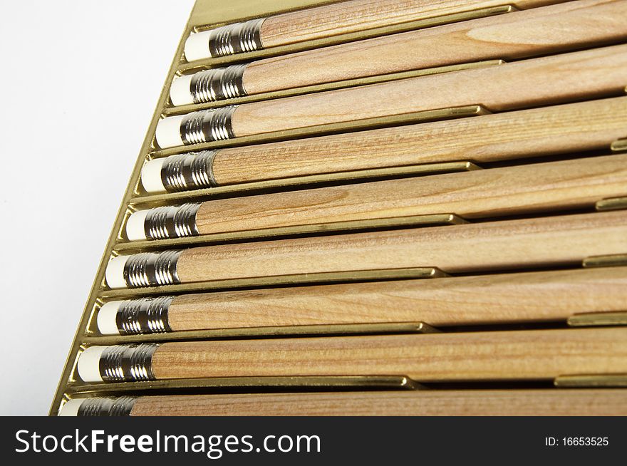 This image shows a box of pencils with an eraser on the tip. This image shows a box of pencils with an eraser on the tip