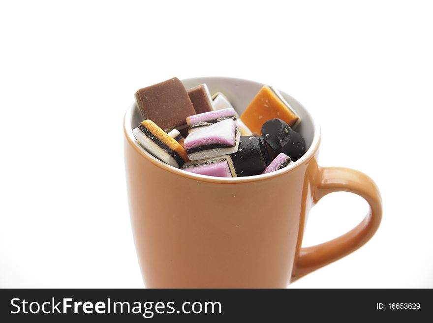 Colored licorice in ceramics cup