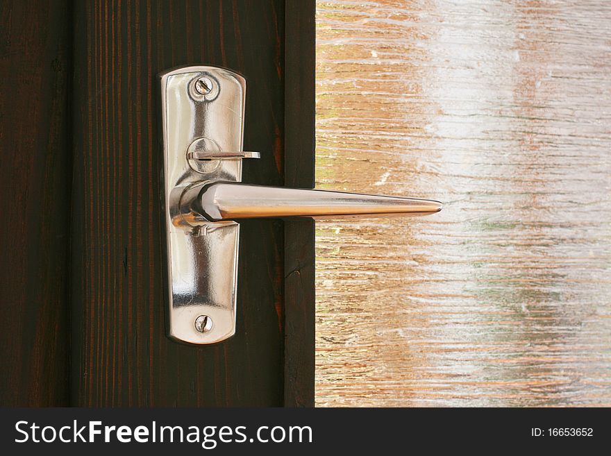 Silver door handle with reflexions (new door). Silver door handle with reflexions (new door)
