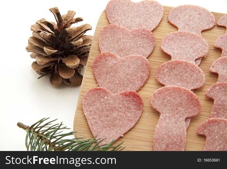 Sausage plate with pine cone and fir branch