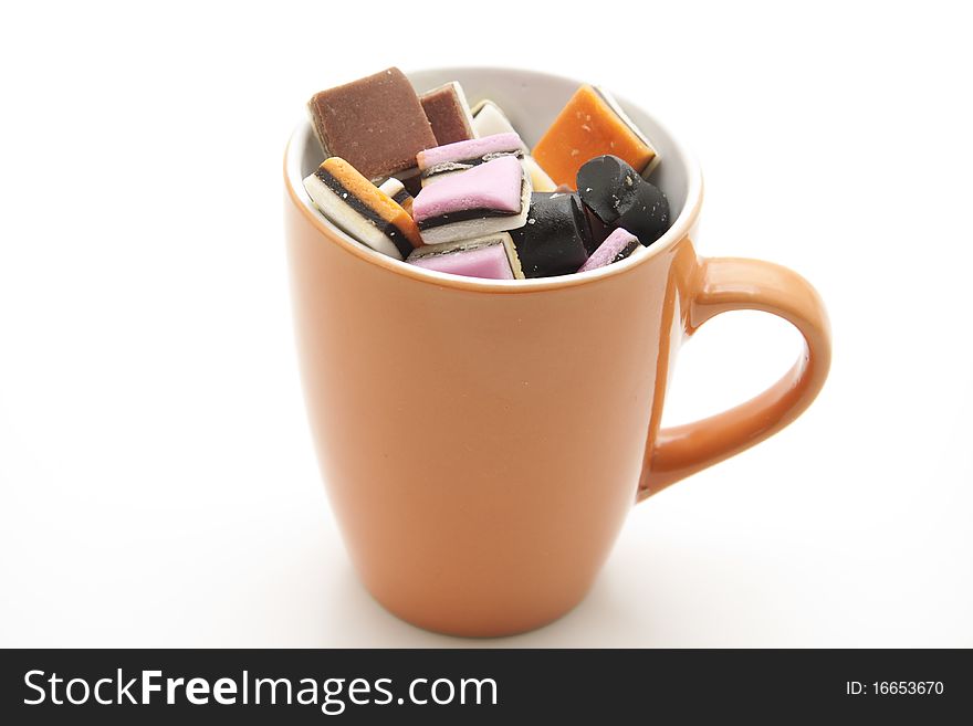 Colored licorice in ceramics cup