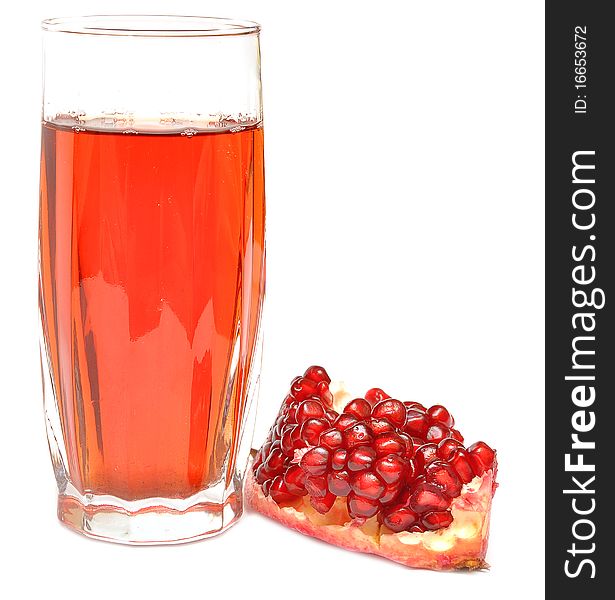 Pomegranate juice in a glass isolated on a white background.
