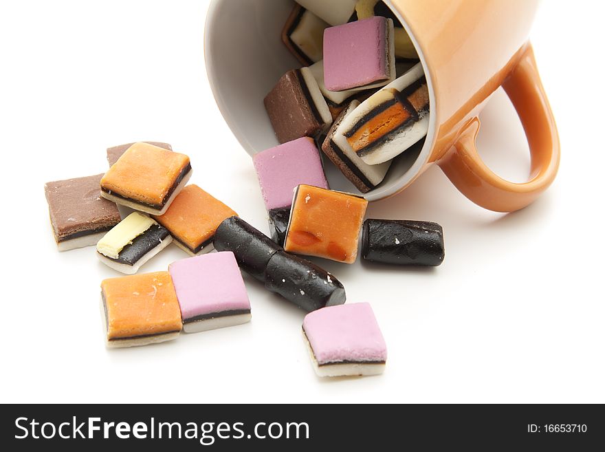 Colored licorice in ceramics cup