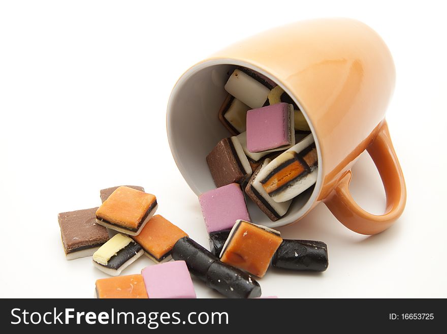 Colored licorice in ceramics cup