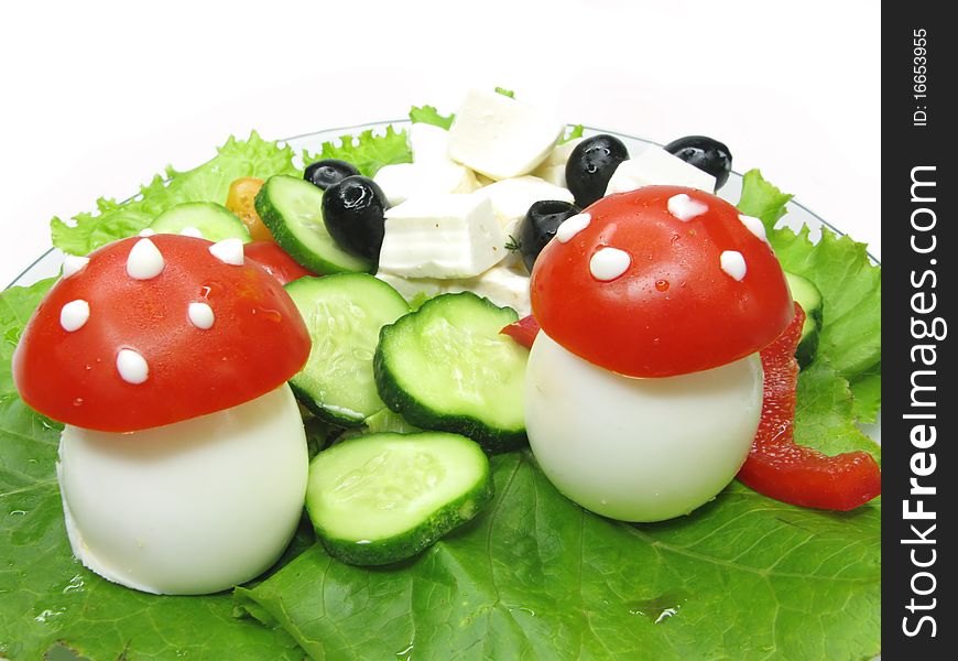 Creative vegetable salad with mushrooms made of egg and tomato