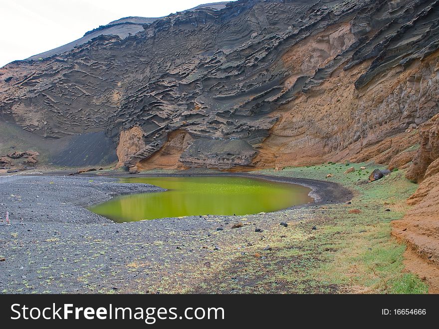 Scenic view of Green Lagoon in volcanic landscape. Scenic view of Green Lagoon in volcanic landscape