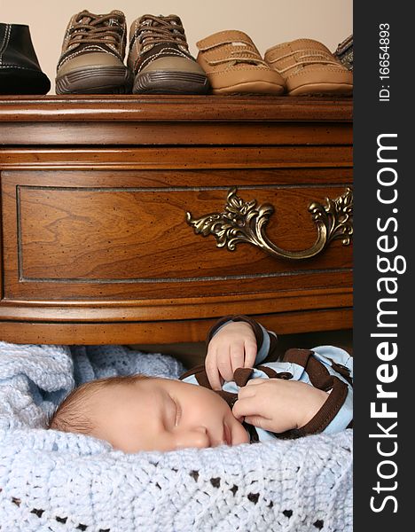 Month old baby boy sleeping in a drawer. Month old baby boy sleeping in a drawer
