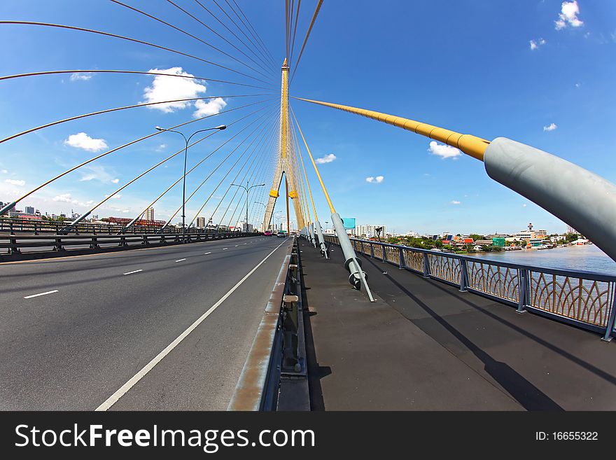 Mega sling Bridge,Rama 8, near Harbor with beautiful sunny in Bangkok, fish eye perspective