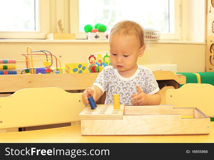 Baby playing with toy blocks