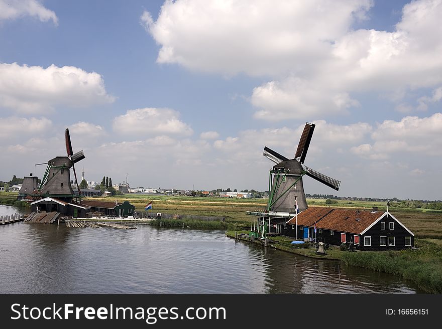 Dutch windmill on a canals edge Netherlands