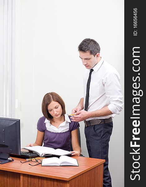 Office workers posing for camera near table