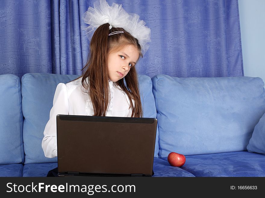 Girl With Laptop And Red Apple