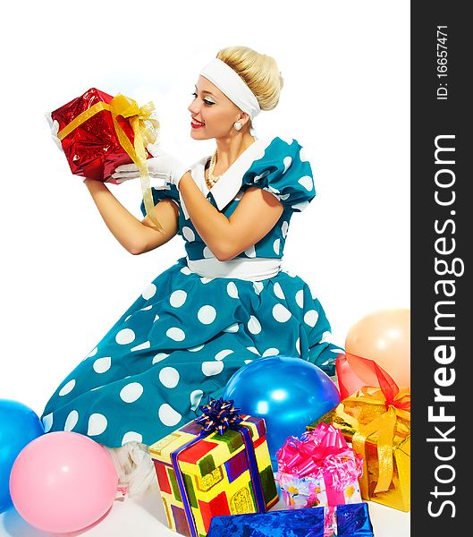 Young woman with colorful gifts isolated on a white background