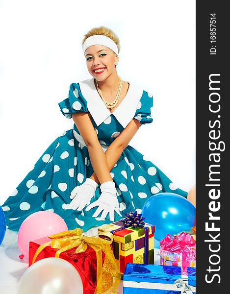 Young woman with colorful gifts isolated on a white background