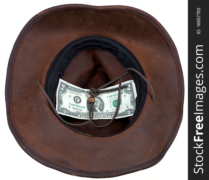 Leather brown cowboy hat with 2 dollars banknote within. Leather brown cowboy hat with 2 dollars banknote within