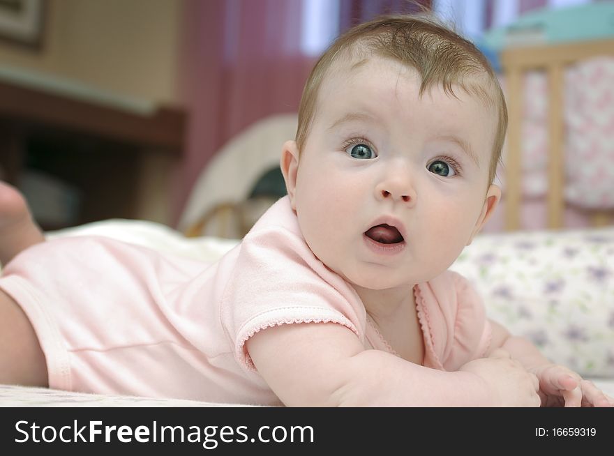 Closeup portrait of adorable baby girl looking at camera