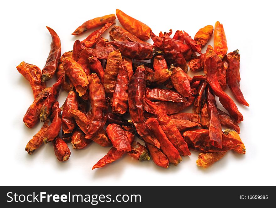 Some Dried Chili Peppers isolated on White.