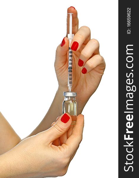 Filled syringe in a woman hands isolated on white background. Filled syringe in a woman hands isolated on white background