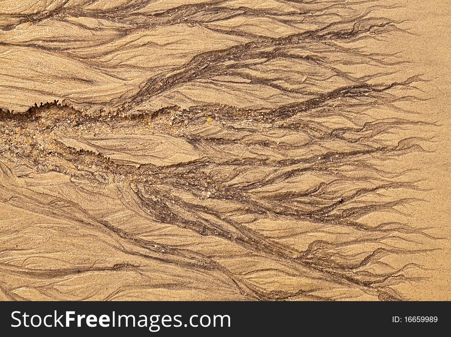 Artistic shapes in the sand on the beach