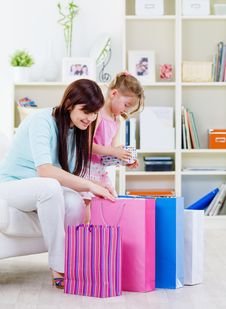 Mother And Daughter With Purchases At Home Royalty Free Stock Photos Mother And Daughter With Purchases At Home Royalty Free Stock Photos