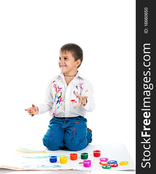 Adorable 3 year old boy covered in bright paint. Adorable 3 year old boy covered in bright paint.