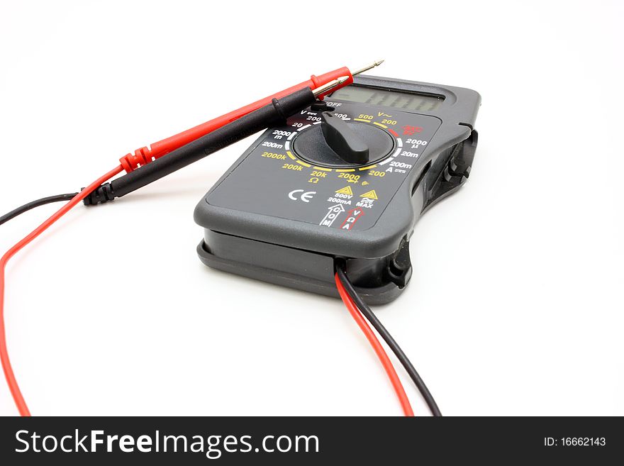 Multimeter of black color with a red and black wire on a white background