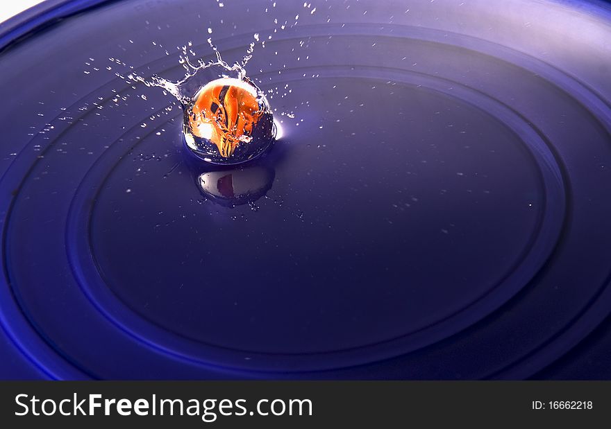 A marble falling in water