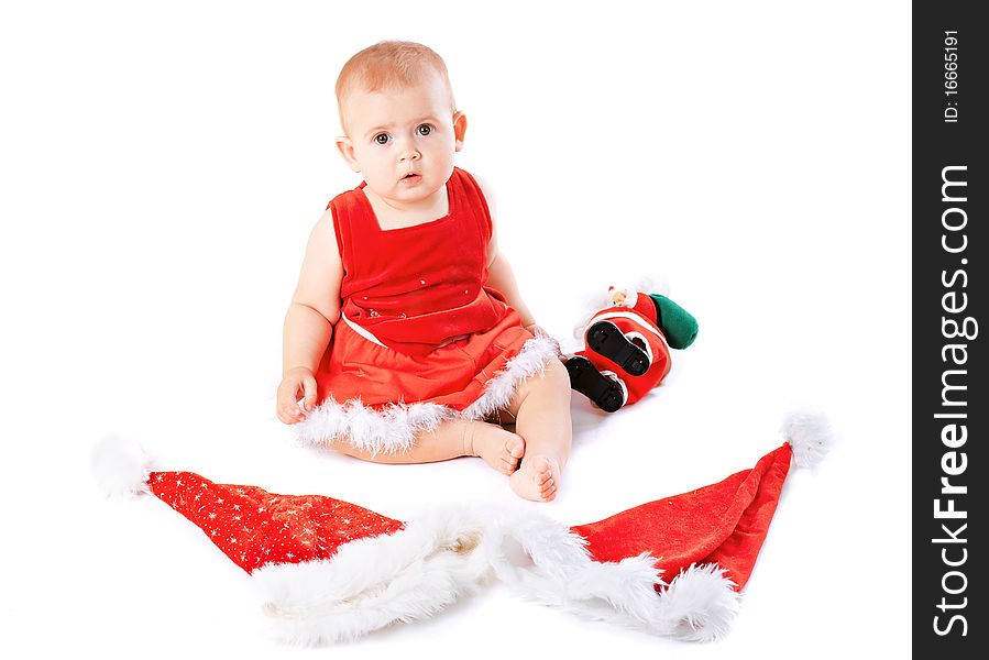 Baby in Santa Claus hat on white background