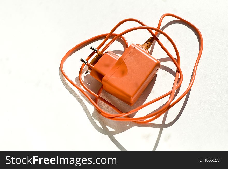 Orange Charger For A Mobile Phone