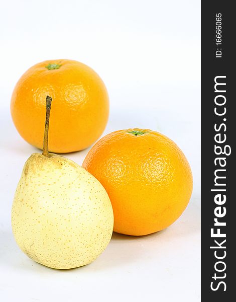 pears and oranges isolated on a white background